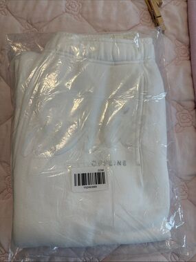 Womens White Sweatpants with Subtle Embroidered Detail. Last picture shows style
